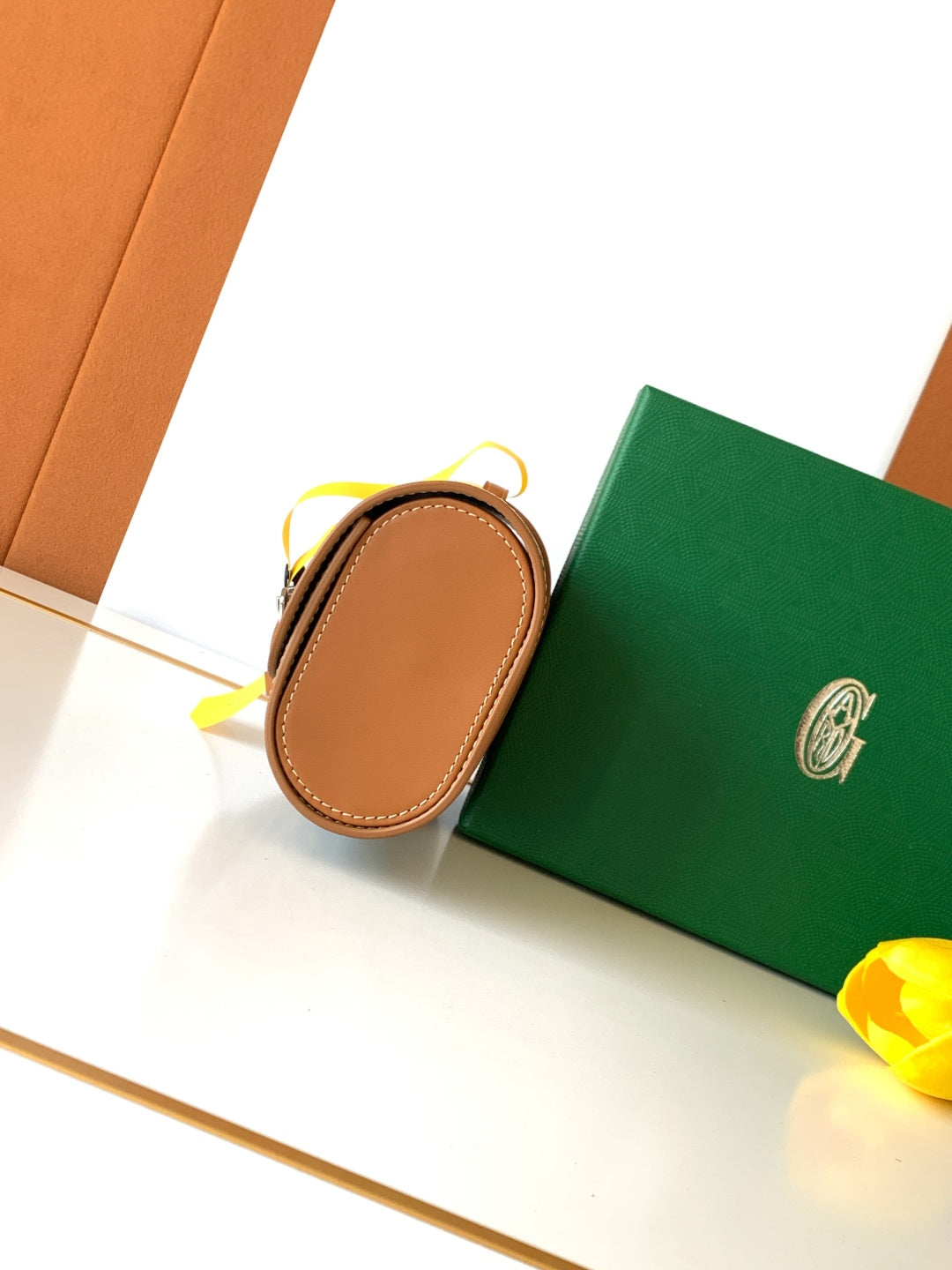 Goyard small pouch bag with tan leather edge and yellow pull cord