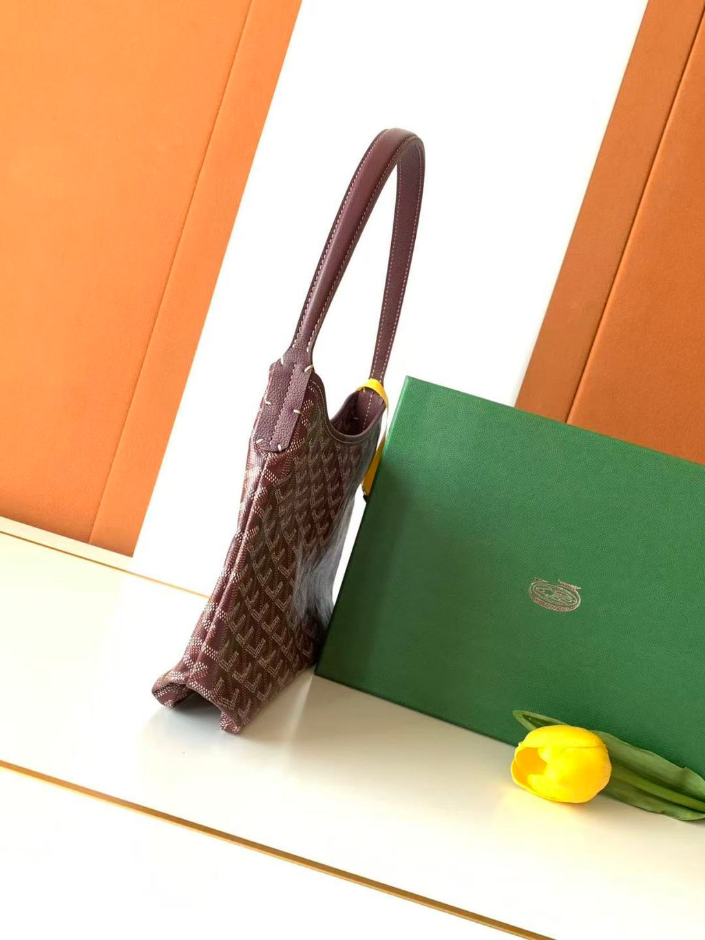 Monogram hobo bag with top handle, side view, brown canvas and leather trim