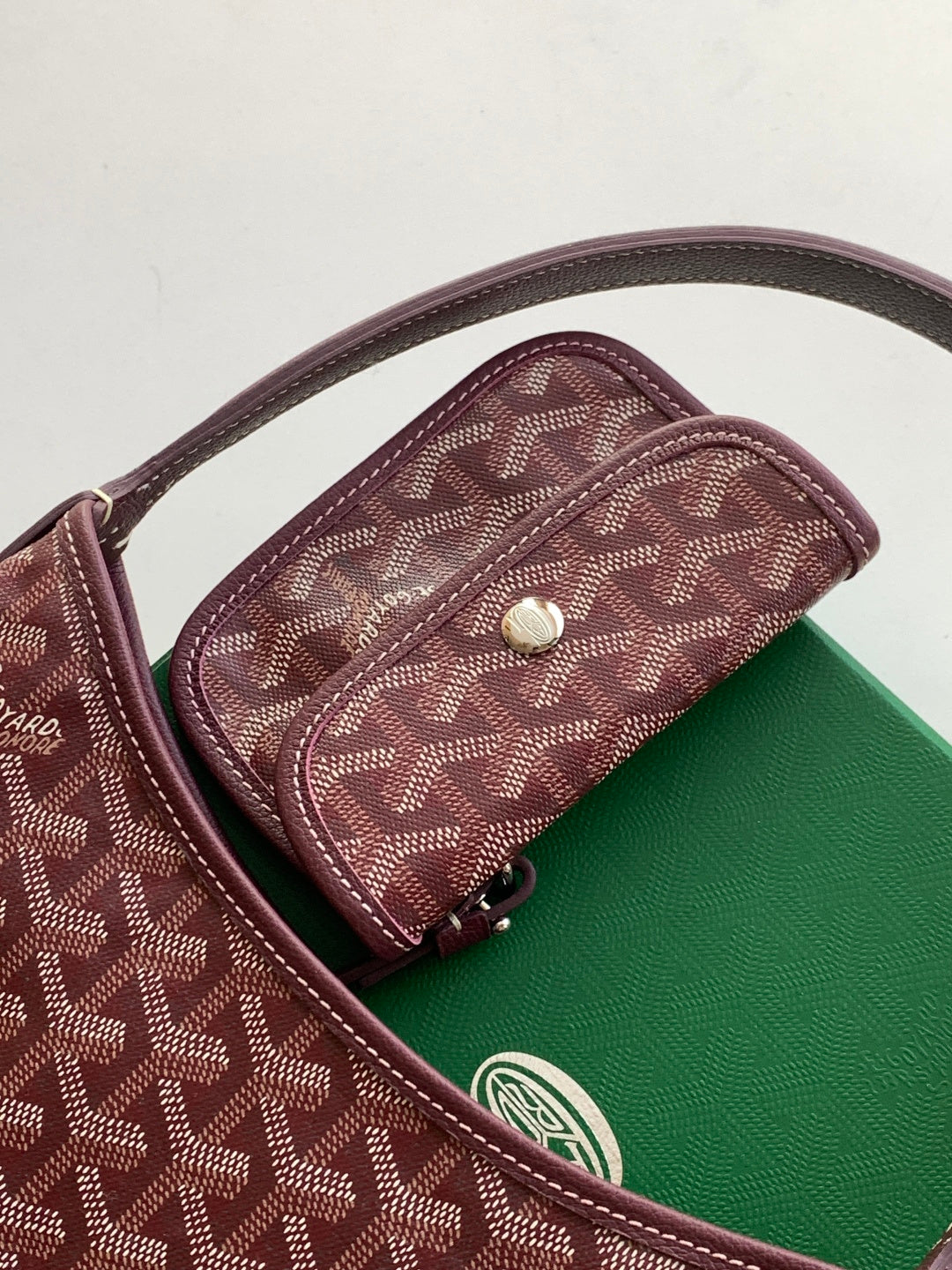 Monogram bag with top snap tab, brown canvas pattern and leather edging