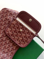Monogram bag front pocket with snap closure, brown leather trim and rivets