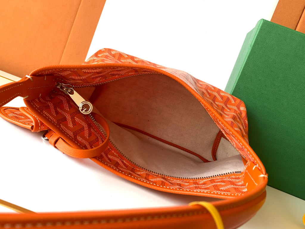 Goyard patterned handbag with open interior, orange zipper and leather trim