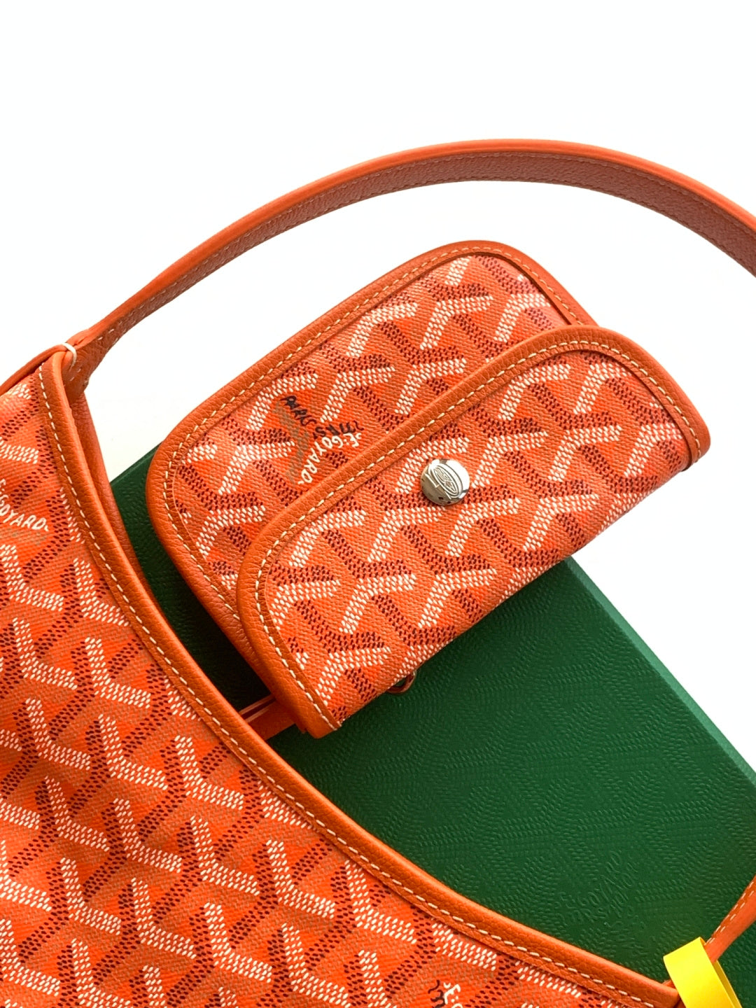 Goyard monogram mini top pocket with snap and green interior view