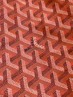 Goyard Paris Saint Honoré logo stamp on orange patterned fabric