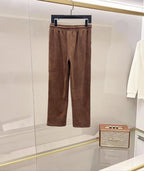Brown corduroy pants with elastic waistband, drawstring, and relaxed straight legs