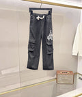 Dark gray denim cargo pants with elastic waistband and side flap pockets