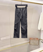 Dark gray denim cargo pants with elastic waist and cargo flap pockets