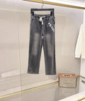 Denim pants in dark gray with white PRADA graphic and drawstring waist