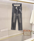 Denim pants in dark gray with white PRADA graphic and drawstring waist
