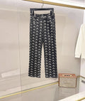 Balenciaga pants with all-over black-and-white logo pattern, straight leg