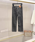 Balenciaga pants with black all-over logo print, front fly and button