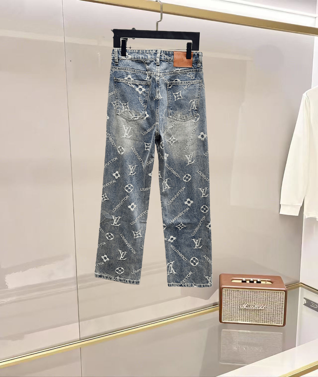 Light blue denim pants featuring scattered white Louis Vuitton monogram print