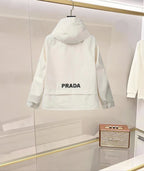 White hooded long jacket with PRADA logo text on back