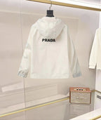 Prada hooded long jacket in white with PRADA back logo and button front