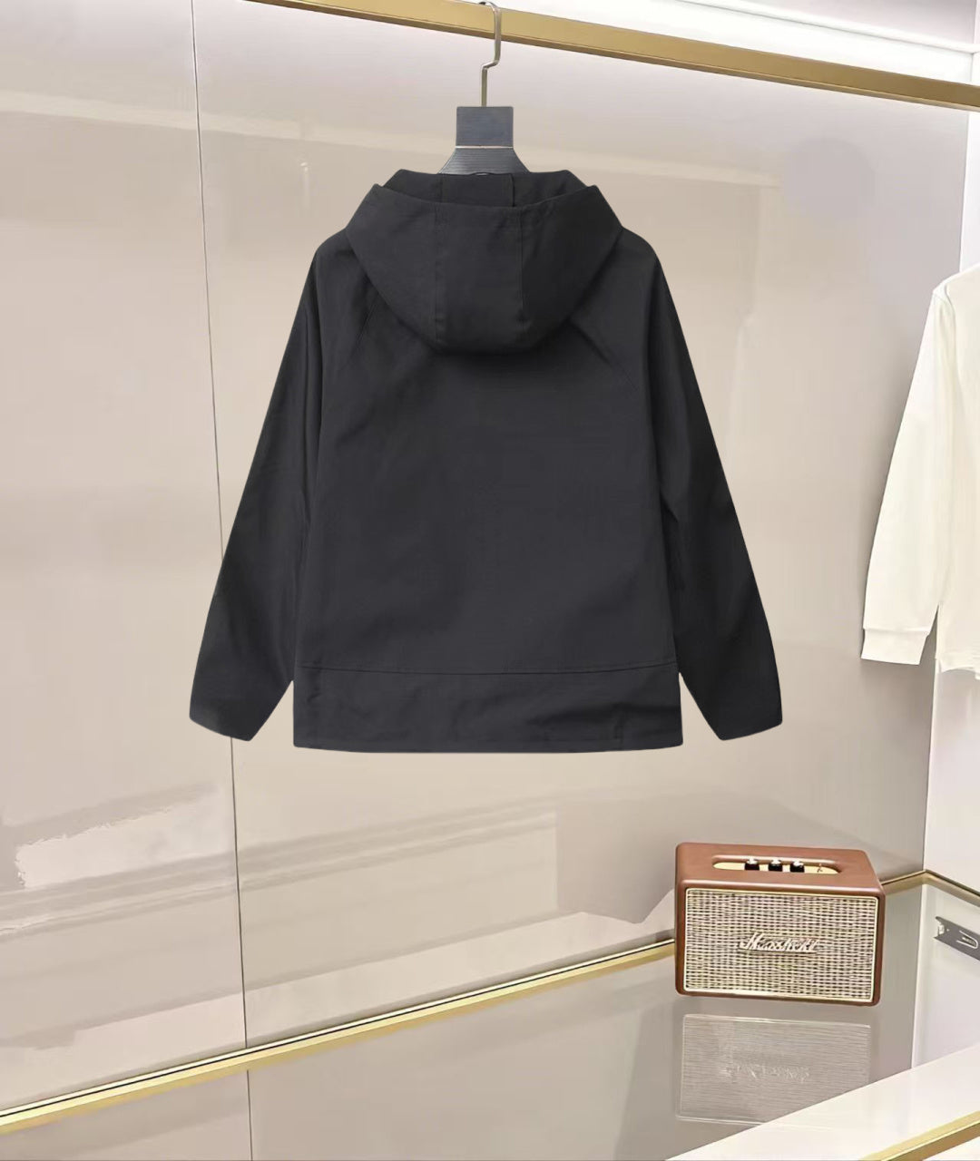 Black Prada hooded rain jacket, rear view with adjustable hem