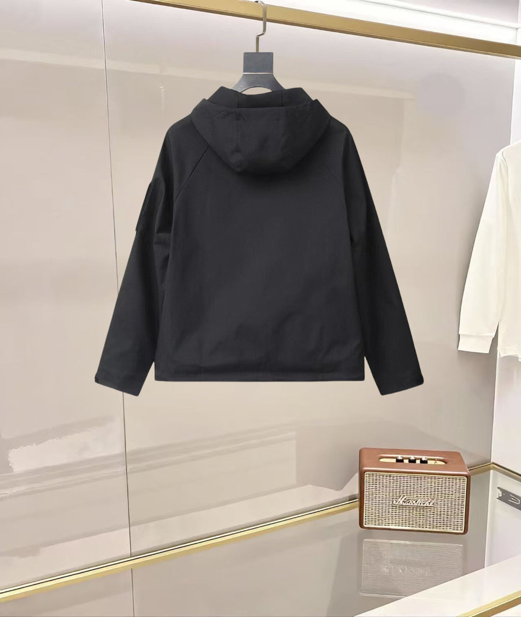 Black hooded jacket with button front and flap pockets, back view