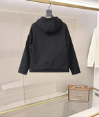 Black hooded jacket with button front and flap pockets, back view