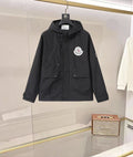 Long hooded Moncler jacket in dark navy with front zipper and logo patch