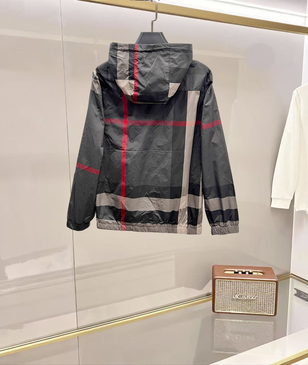 Burberry hooded jacket back view, dark gray with red stripe check, zipped hood