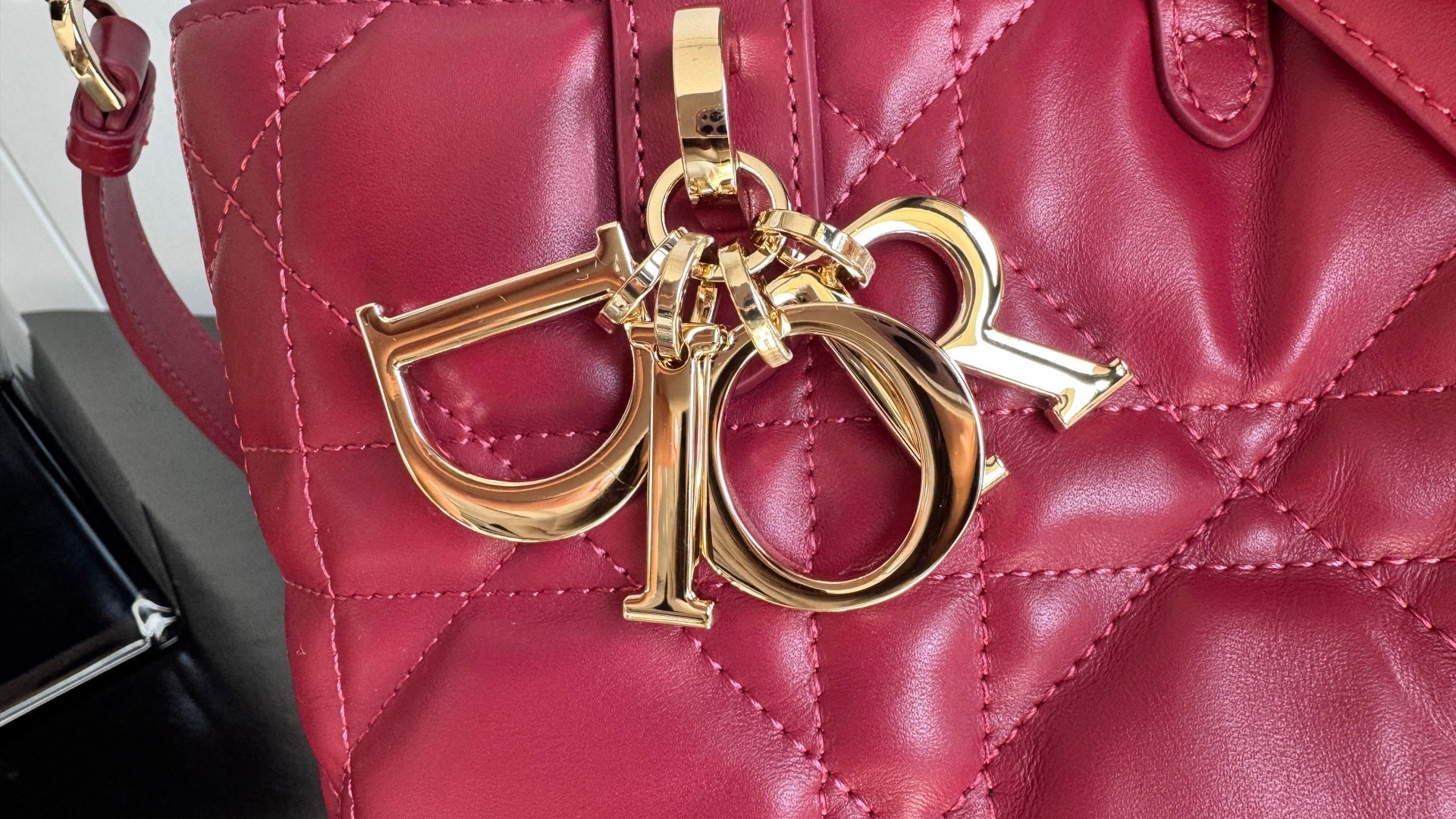 Pink Dior tote bag with gold-tone CD emblem clasp and quilted leather front