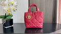 Pink quilted Dior tote bag with top handles and gold-tone hardware at center