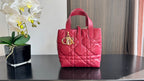 Pink quilted Dior tote bag with top handles and gold-tone hardware at center