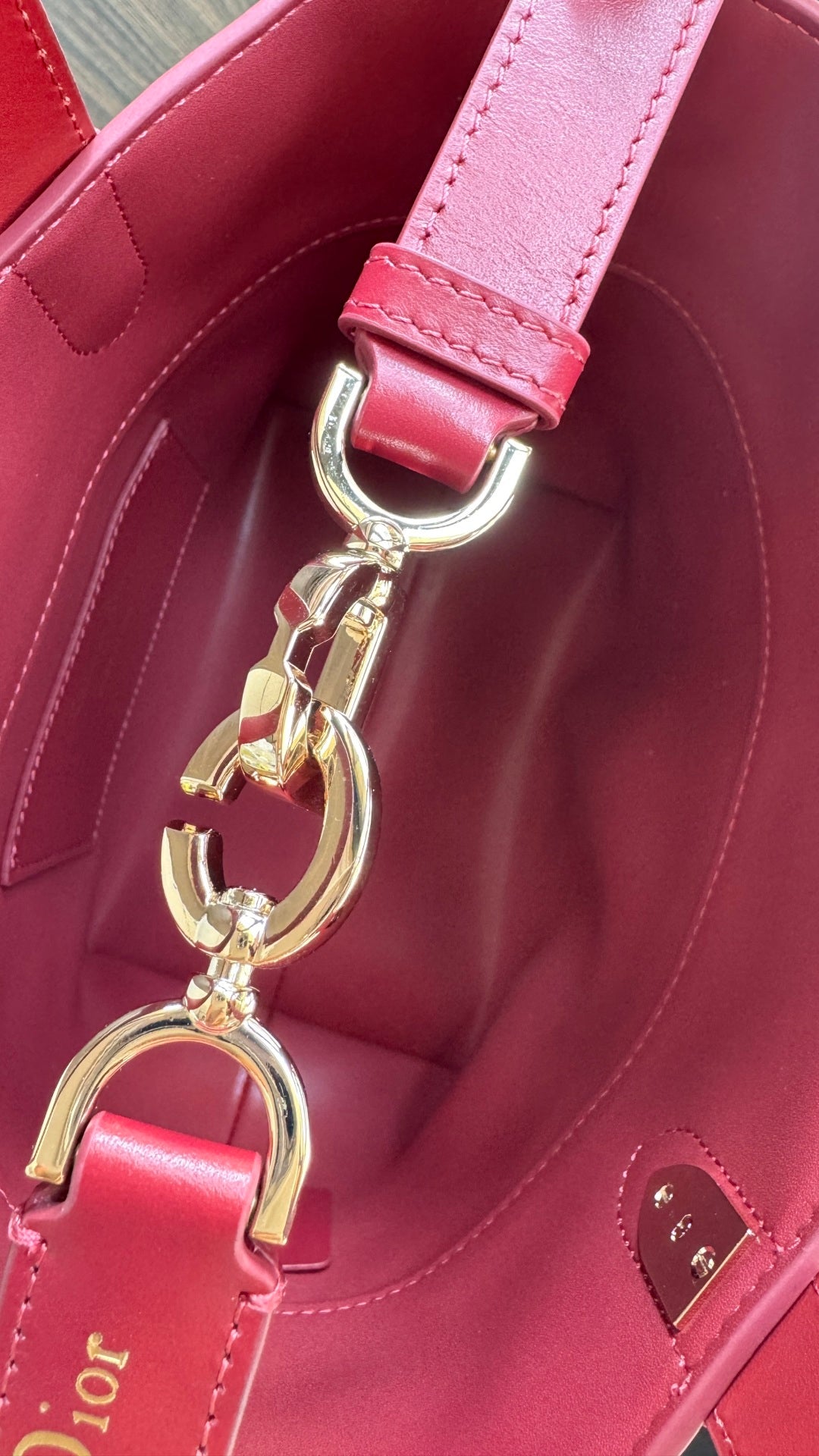 Pink Dior tote bag with gold keyring charm and logo hardware on side
