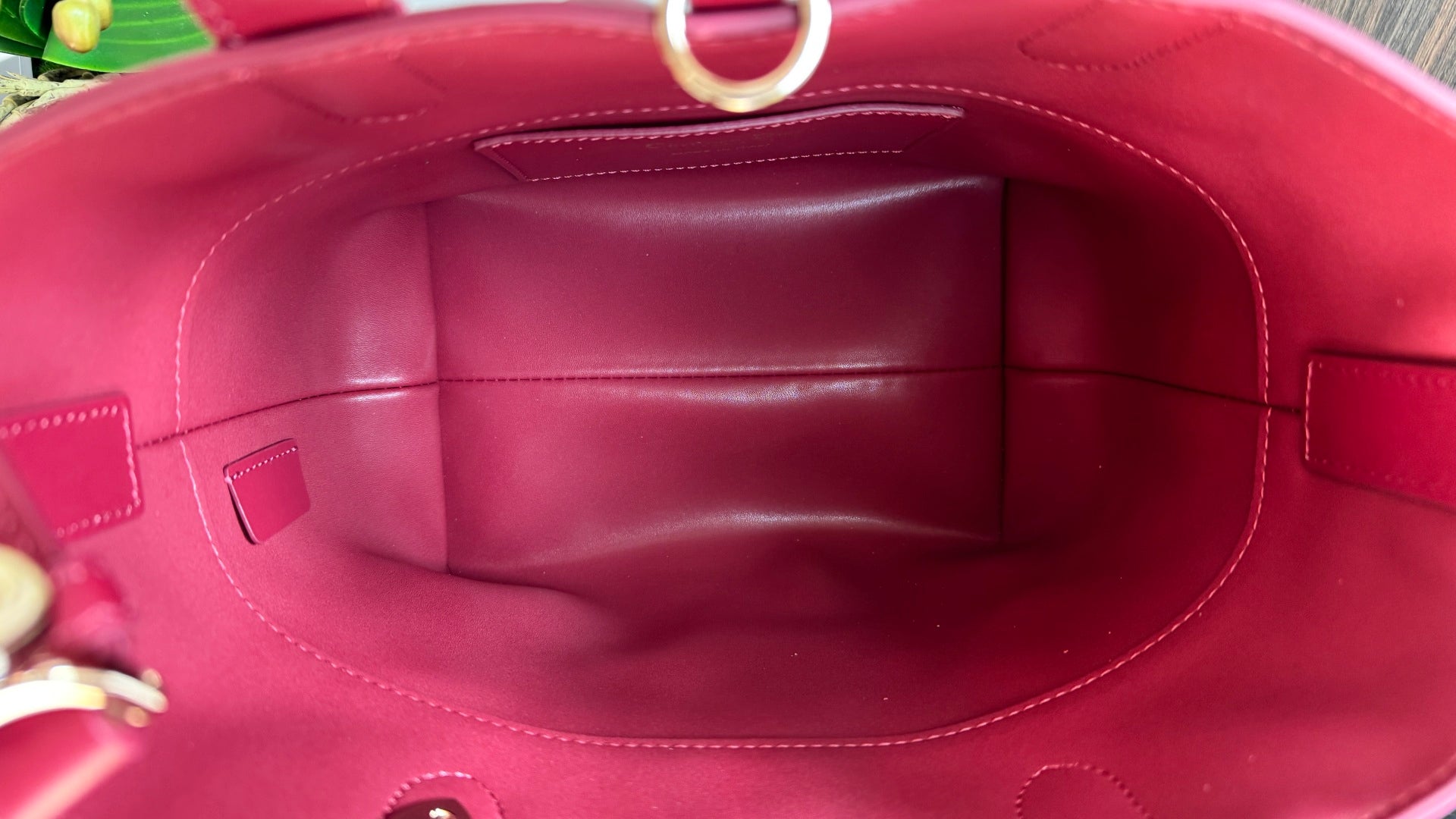 Pink Dior tote bag interior lining with curved opening and stitched side panels