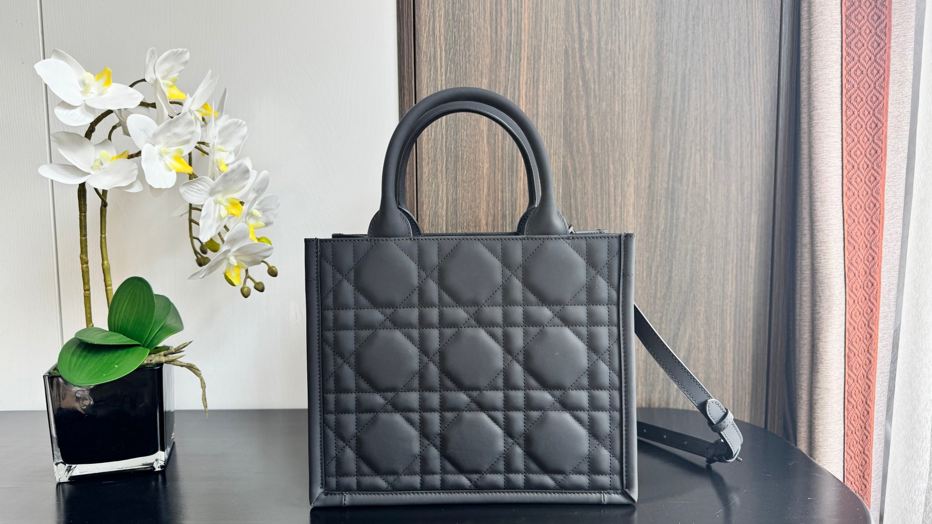 Dior quilted tote bag with top handles and removable strap, dark leather diamond pattern