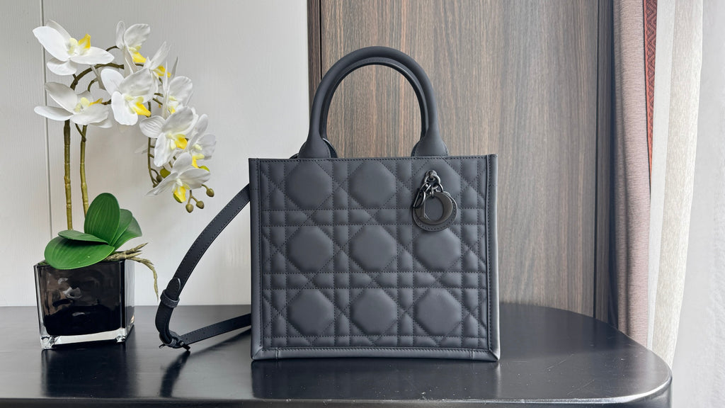 Dior quilted tote bag with top handles and side strap, dark leather with diamond stitching