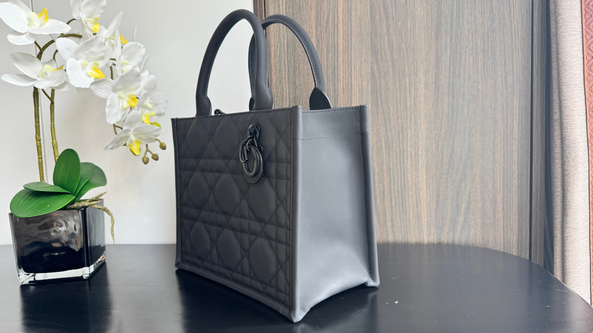Dior small tote bag with top handles, dark leather and diamond-quilted front panel