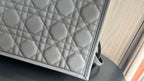 Dior quilted tote bag panel with repeating diamond pattern, dark gray leather