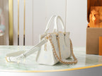 Louis Vuitton mini handbag in white pebbled leather with light blue motifs and shoulder strap