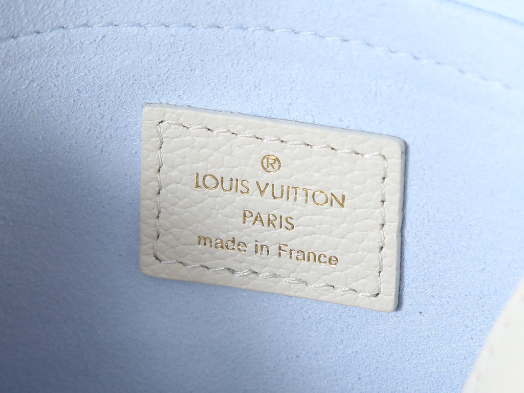 Louis Vuitton interior label on white leather with 'Louis Vuitton' and 'made in France'
