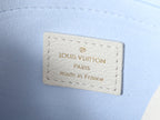 Louis Vuitton interior label on white leather with 'Louis Vuitton' and 'made in France'