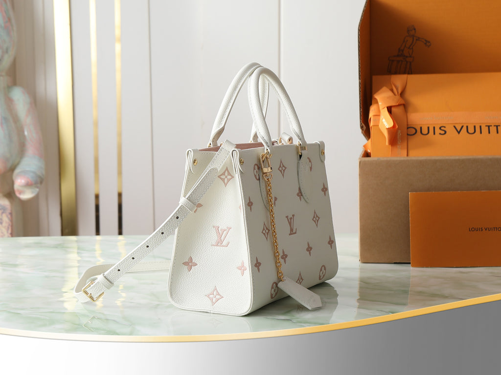 Louis Vuitton bag in white with monogram pattern, shoulder strap and top handles
