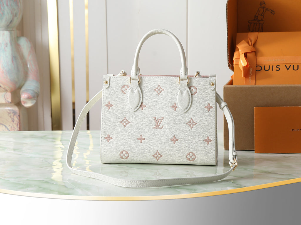 Louis Vuitton bag in white with monogram pattern, dual handles and shoulder strap