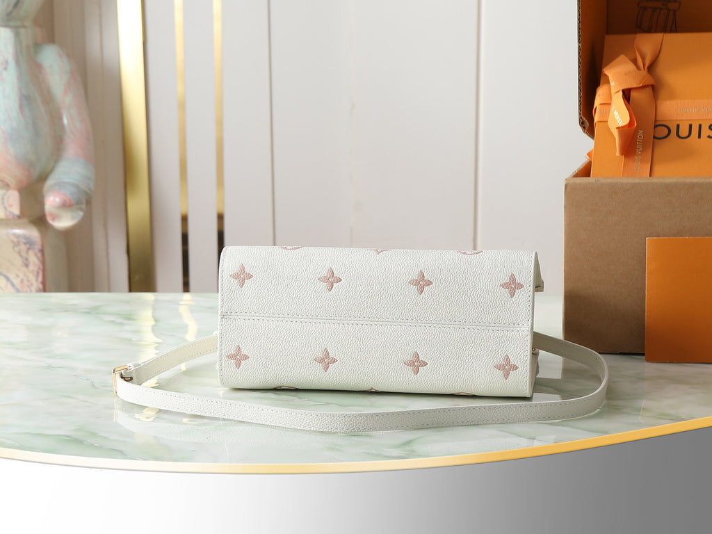 Louis Vuitton bag in white with monogram pattern, top closure and shoulder strap