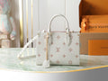 Louis Vuitton bag in white with monogram pattern, top handles and removable strap