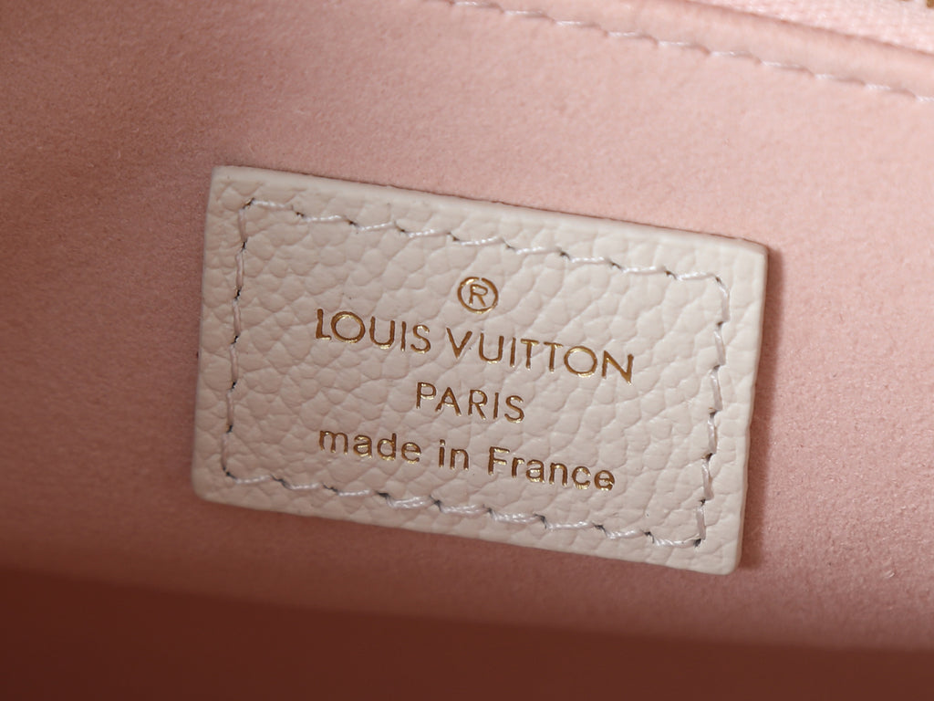 Louis Vuitton bag leather label reading Louis Vuitton Paris, made in France