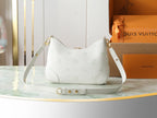 White hobo bag with white shoulder strap and gold chain detail