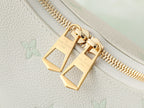 White leather bag zipper pull with gold rectangular hardware