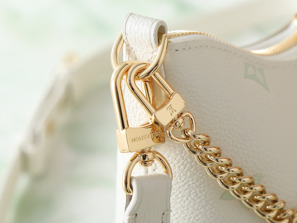 White leather bag clasp with gold chain and lock hardware