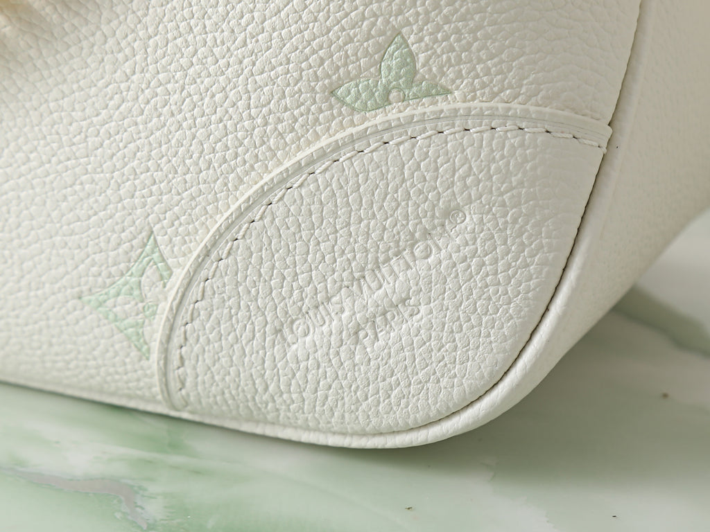 White leather bag base with embossed monogram detail