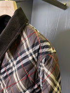Burberry quilted plaid jacket sleeve with black trim and ribbed cuff
