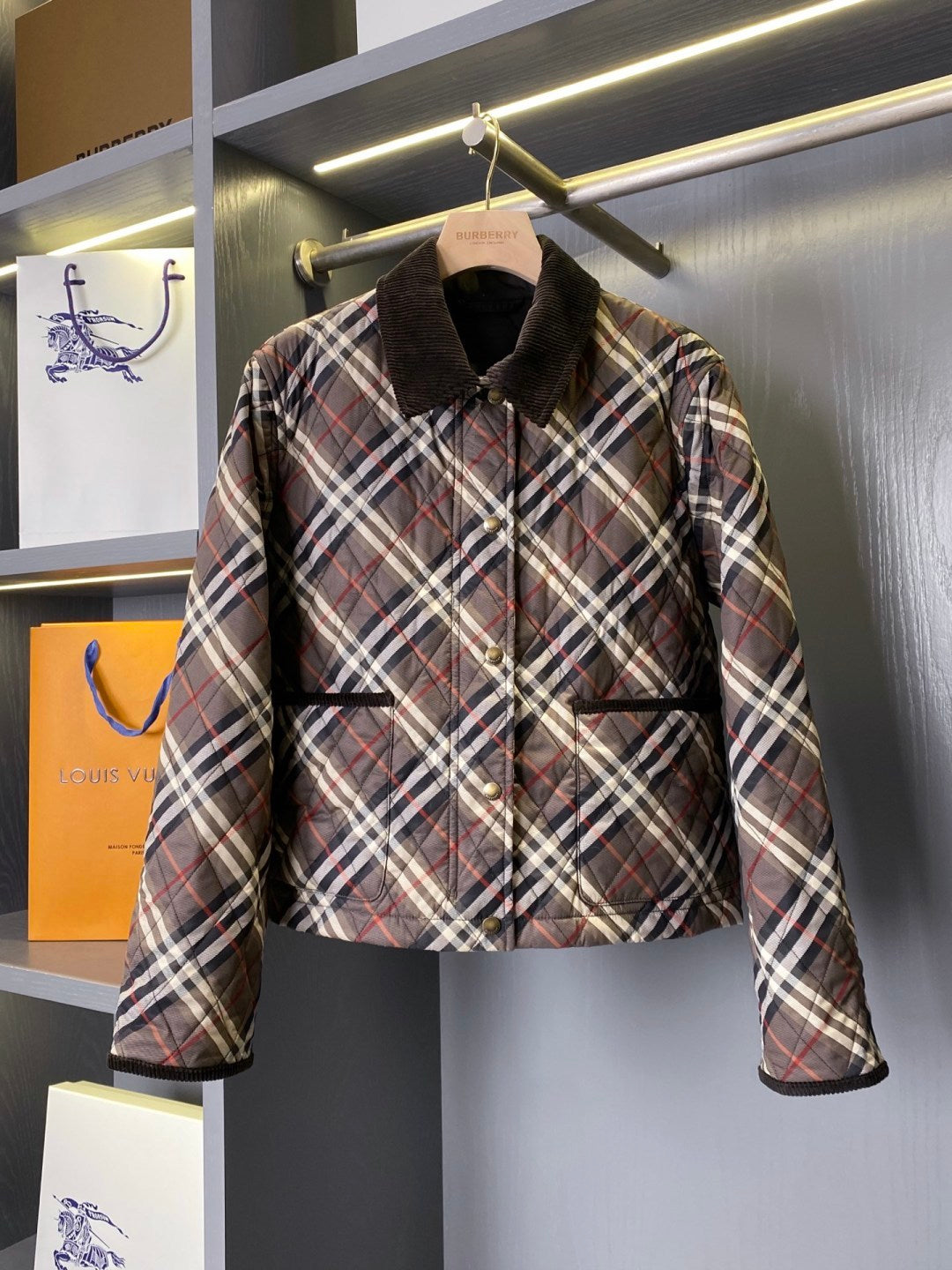 Burberry quilted plaid jacket with black collar and button front