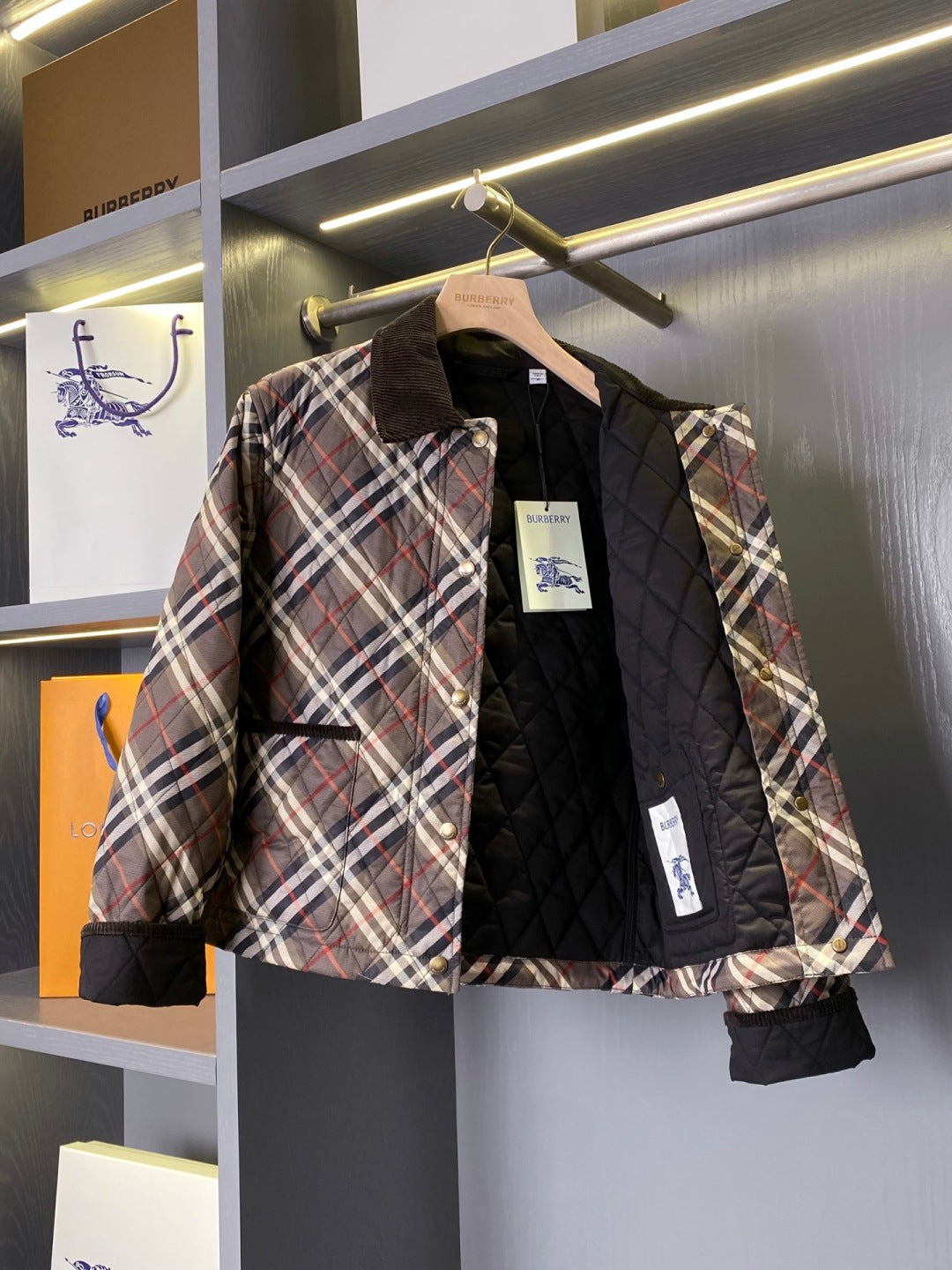 Burberry quilted plaid jacket with black lining and front button placket