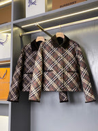 Burberry plaid quilted puffer jacket on hanger with stand collar and snap buttons