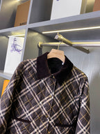 Burberry plaid puffer jacket with stand collar, button placket, quilted body
