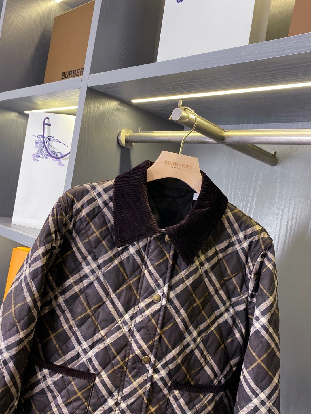 Burberry plaid puffer jacket with stand collar, button placket, quilted body