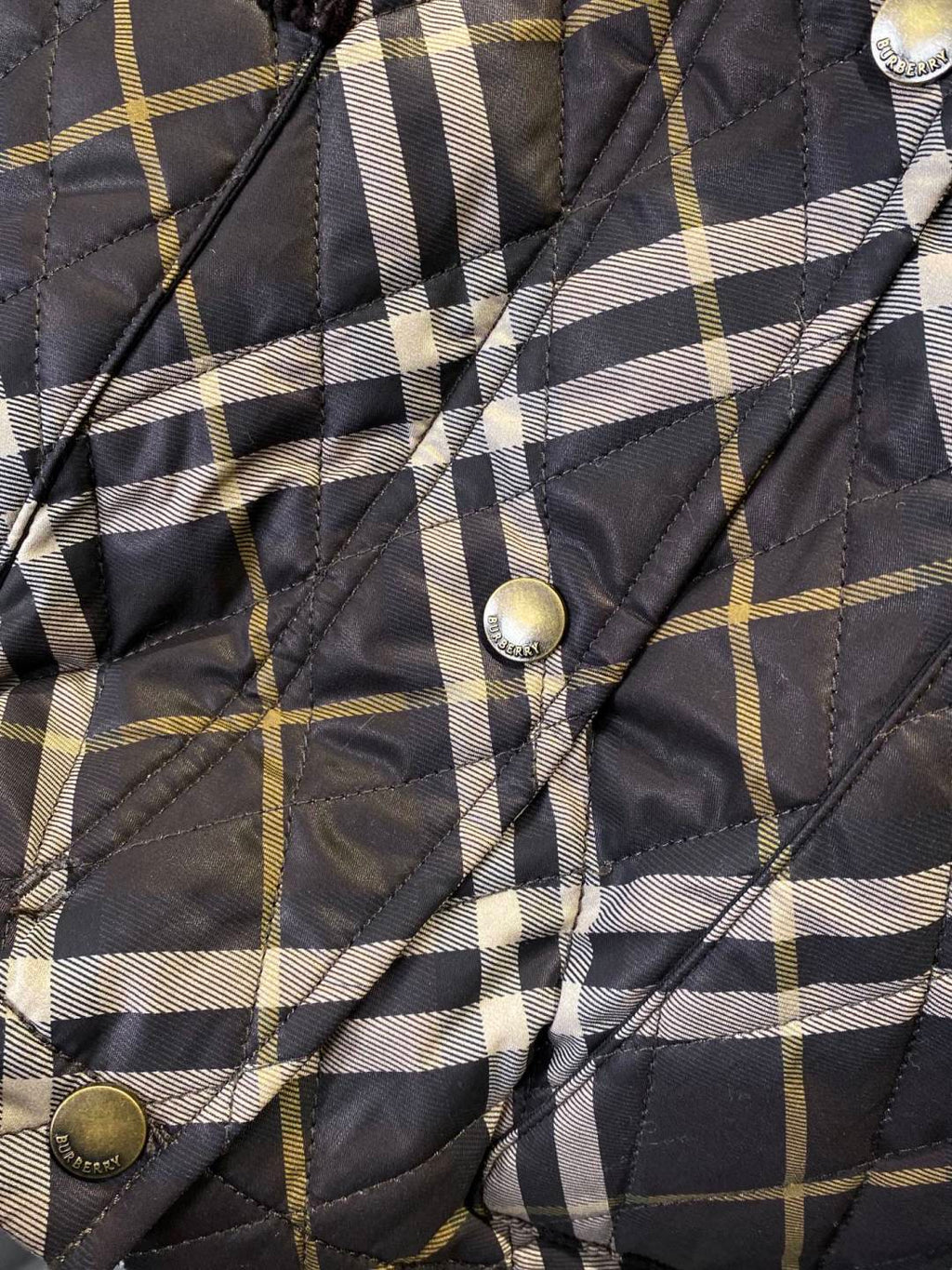 Burberry plaid puffer jacket with metal snap buttons and quilted check pattern